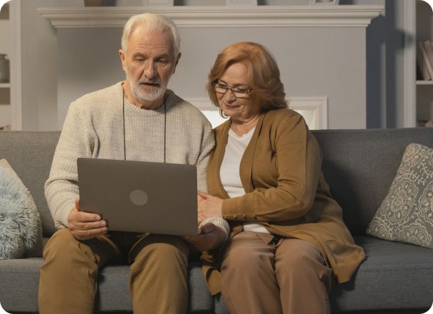 old couple working on laptop