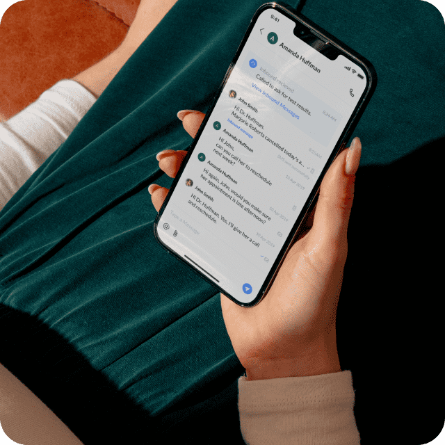 Female doctor showing phone